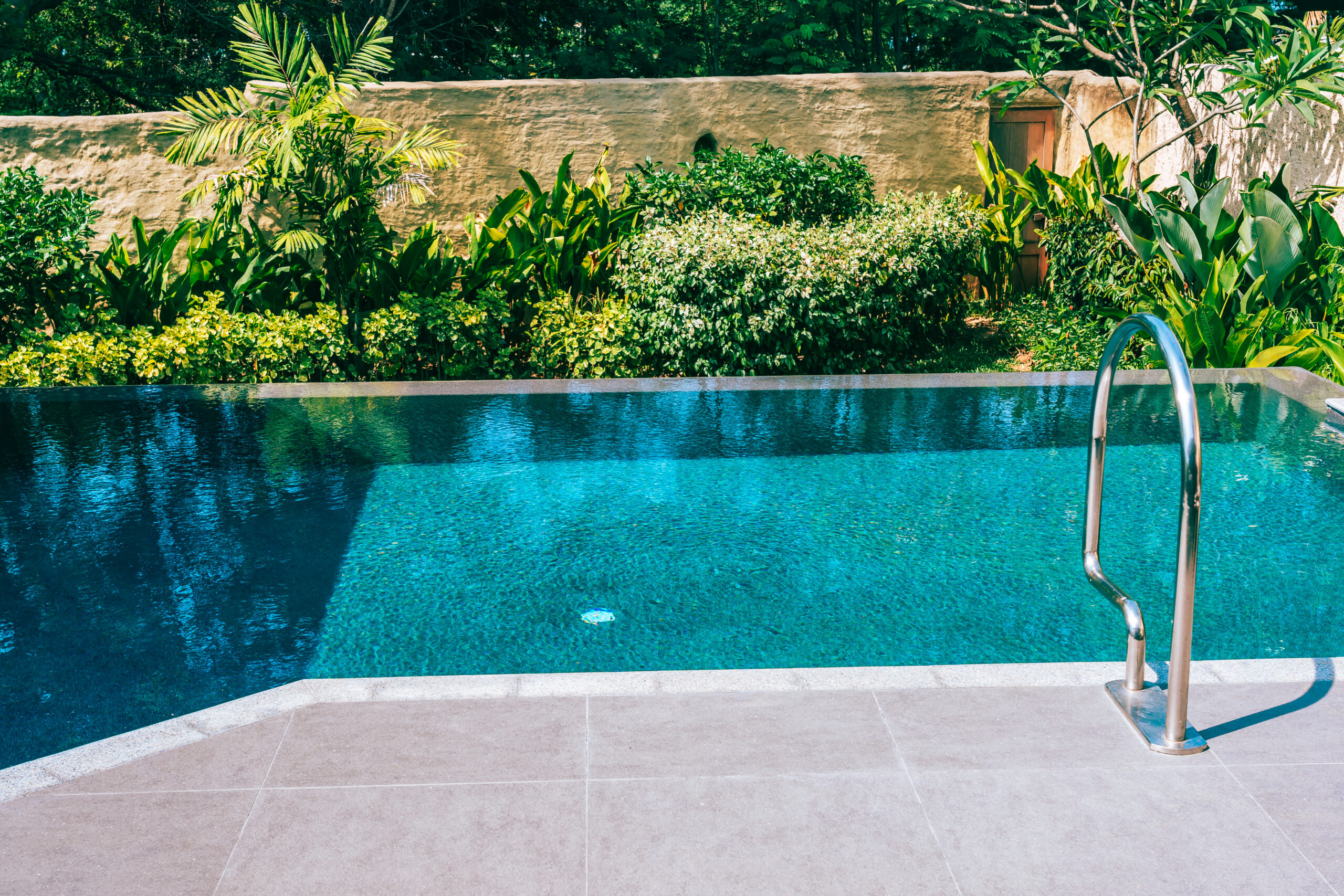 Beautiful landscape outdoor swimming pool in hotel and resort fo